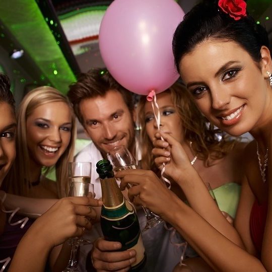 Bachelorette party in limousine with attractive young people